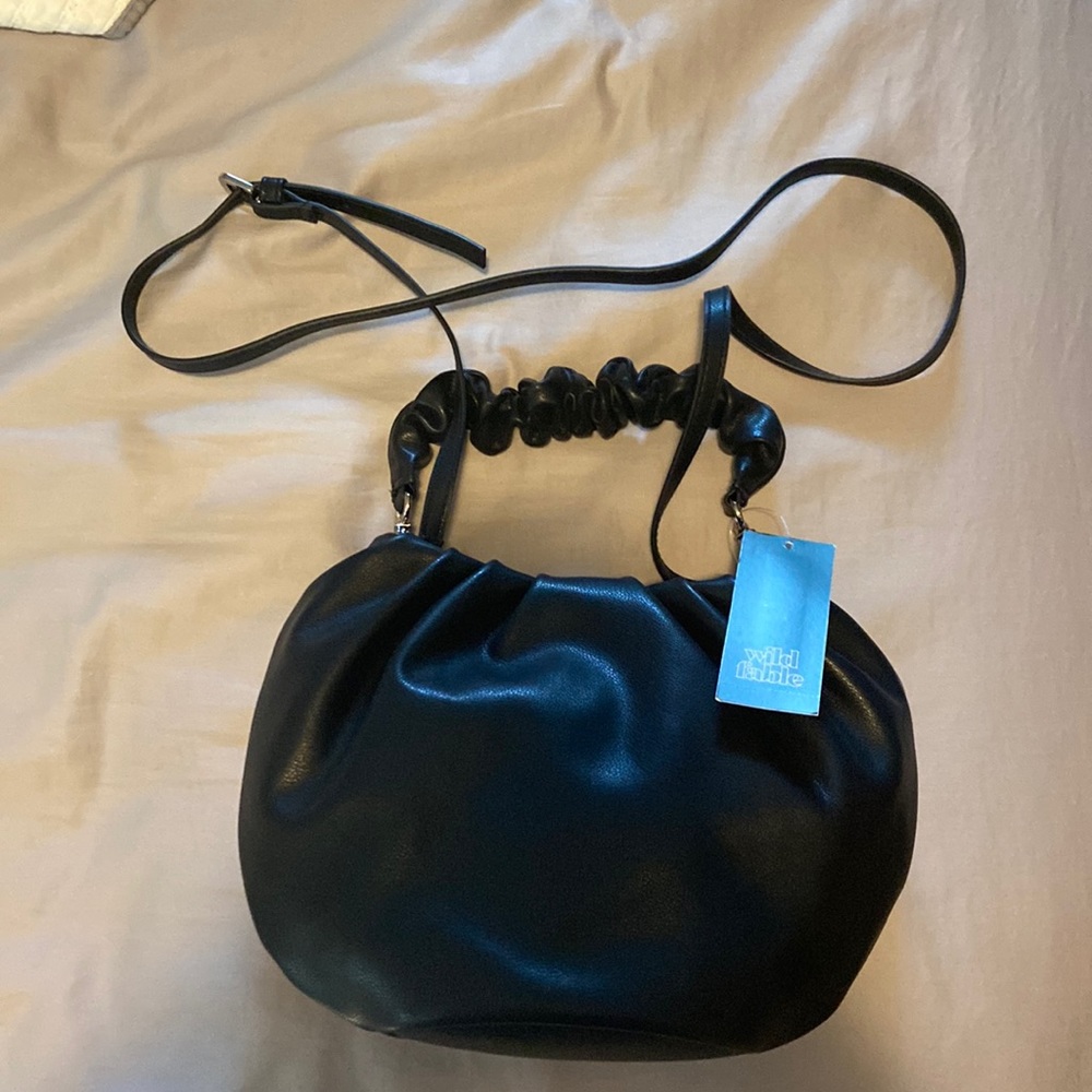 Woman’s black handbag.